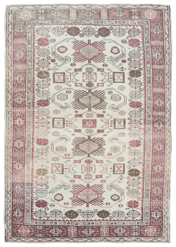 Full overhead view of the 4'3" x 6'1" ivory, rose, and brown vintage Anatolian rug.