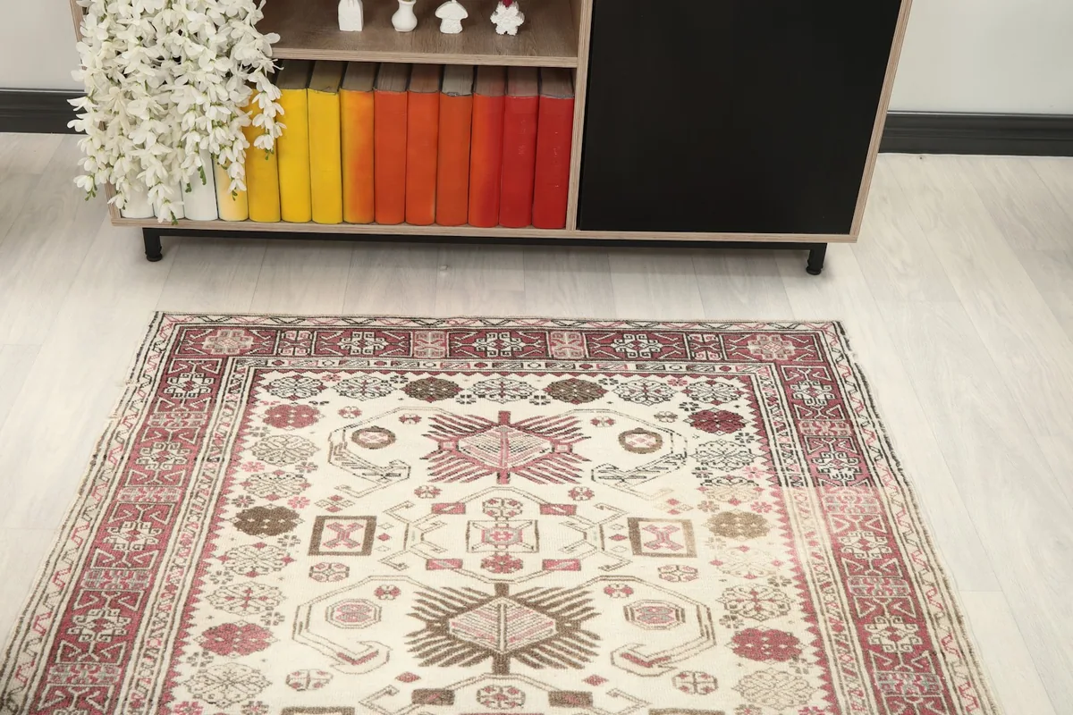 Overhead view of the rug in a room, centered with a console table in the background.