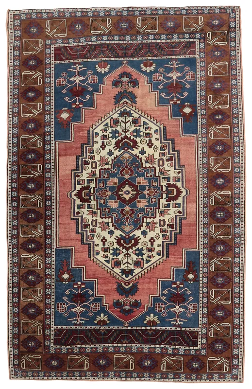 Full top view of the rose, navy, and brown vintage Anatolian wool area rug