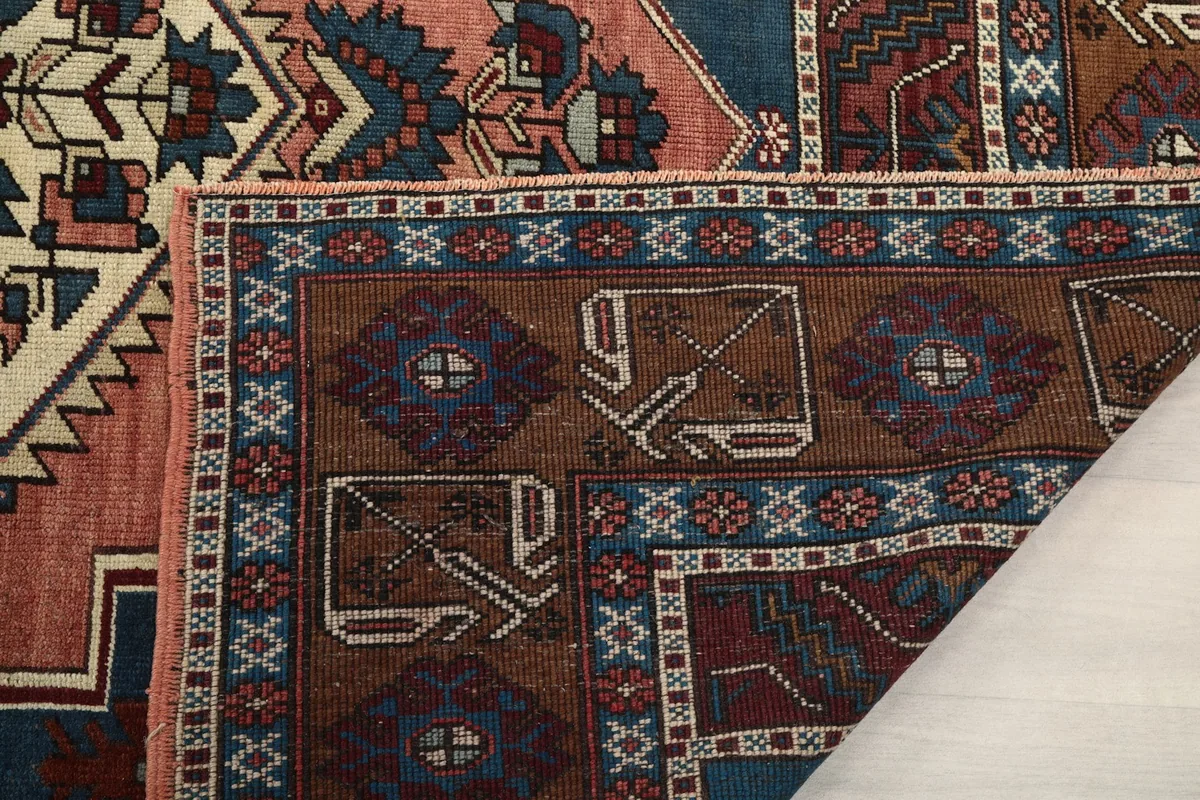 Close-up of the rug's back, revealing the hand-knotted cotton foundation