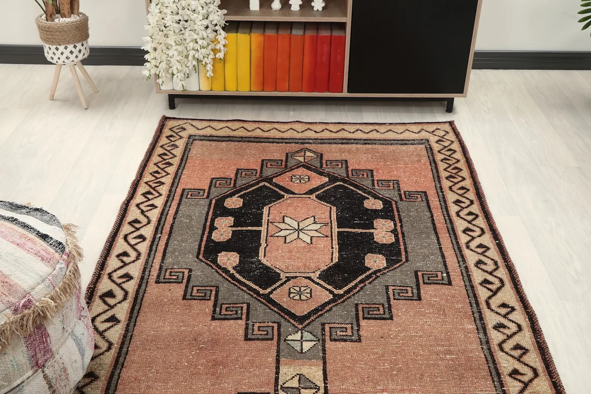 Overhead view of the rose runner rug in a room setting, showing the full length.