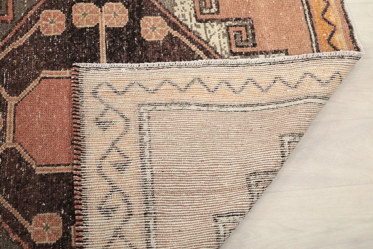 Close-up of the back of the rug, showing the knotting and foundation details.