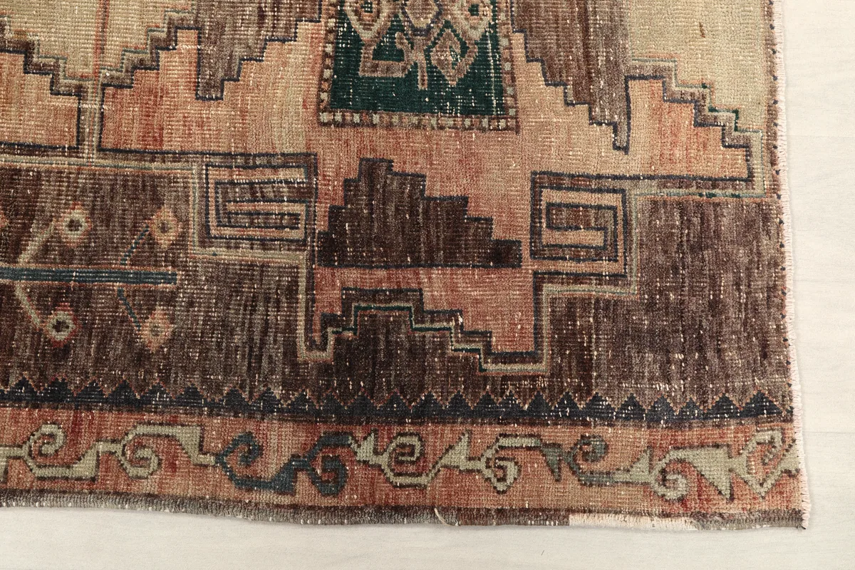 Close-up detail of the Earth Tone Geometric Anatolian Runner, showing faded rust and brown tones.