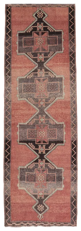 Full top view of the vintage rust and charcoal geometric runner rug on a white background.