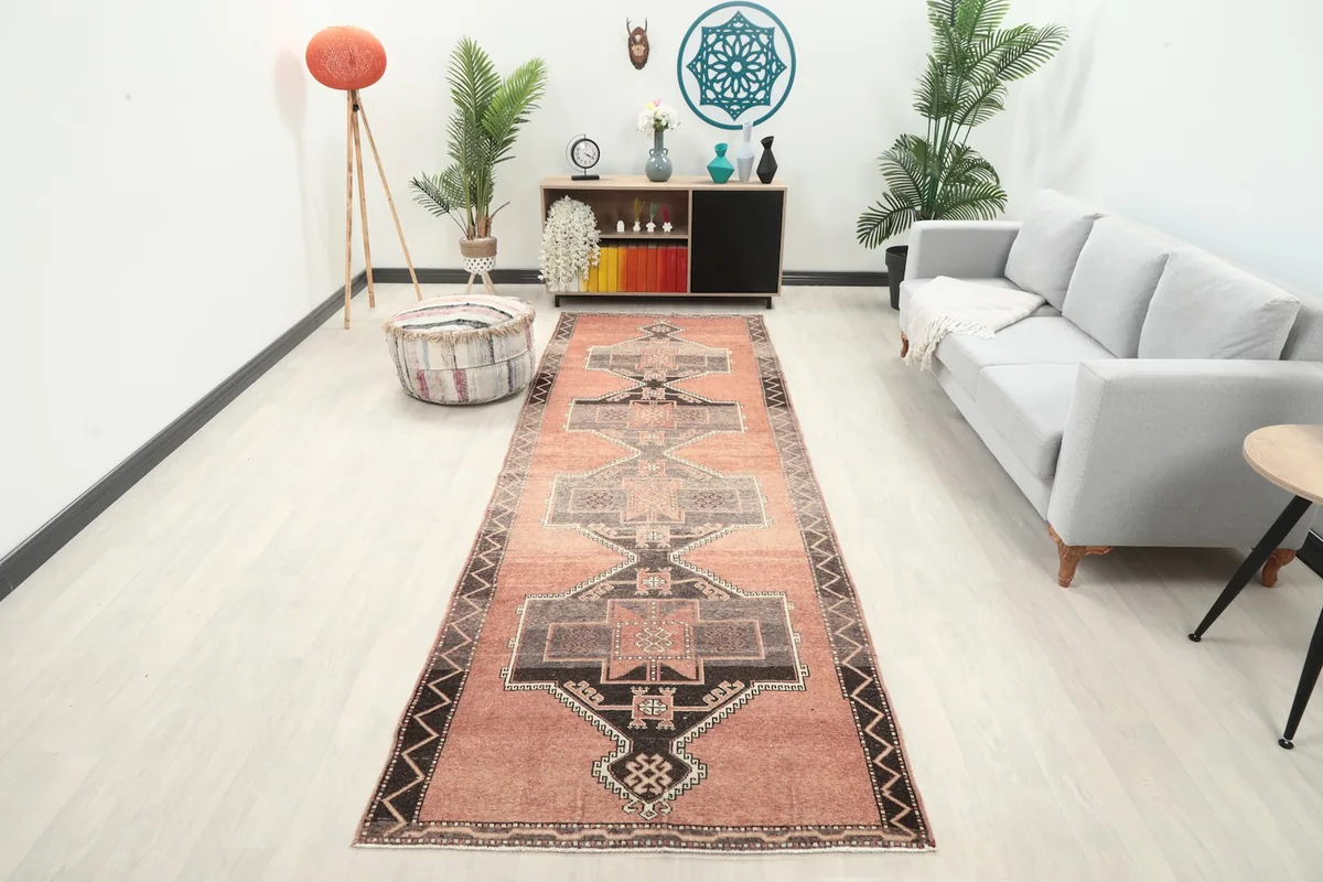 Vintage runner rug in a modern living room setting, showing its length in a hallway.