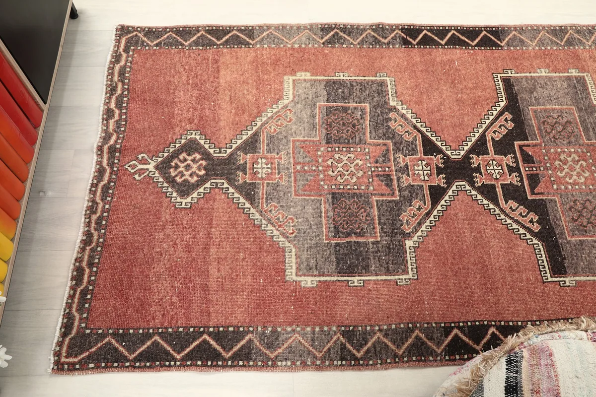 Overhead view of the runner rug, capturing the full width of the geometric design.