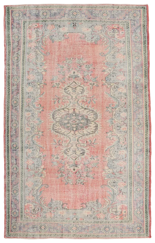 Full top view of the 6x10 rose vintage Anatolian rug with central medallion and floral motifs