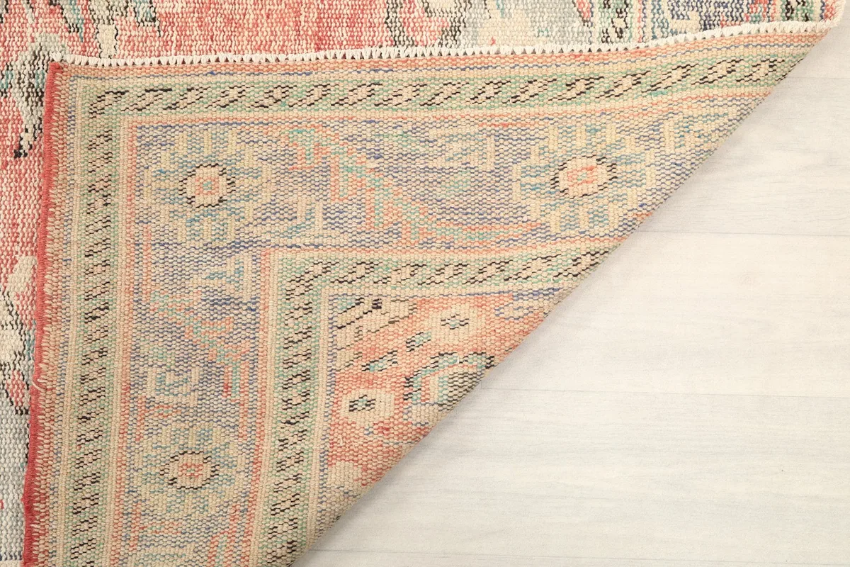 View of the reverse side of the rug, showing the knotting of the cotton foundation