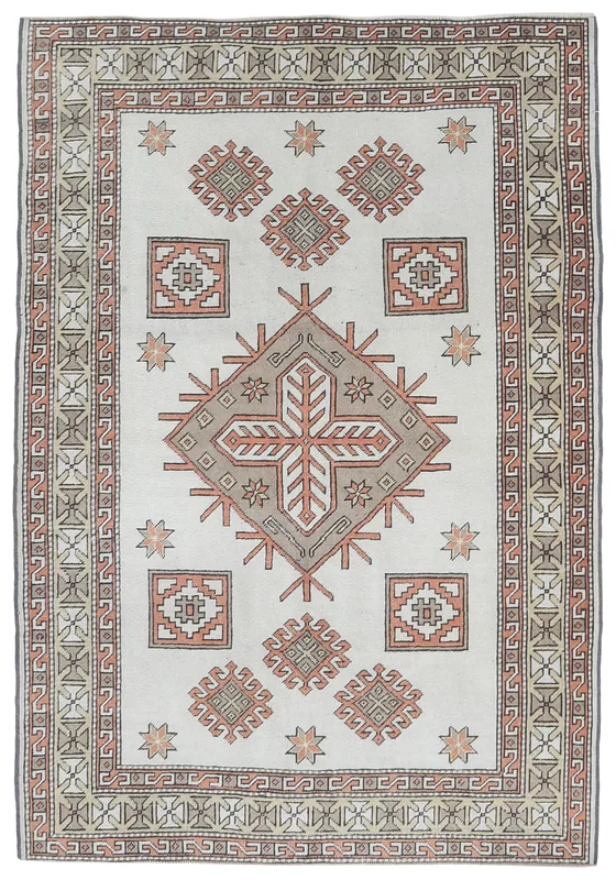 Full overhead view of the 4'6" x 6'6" ivory and rust geometric Anatolian rug on a white background.