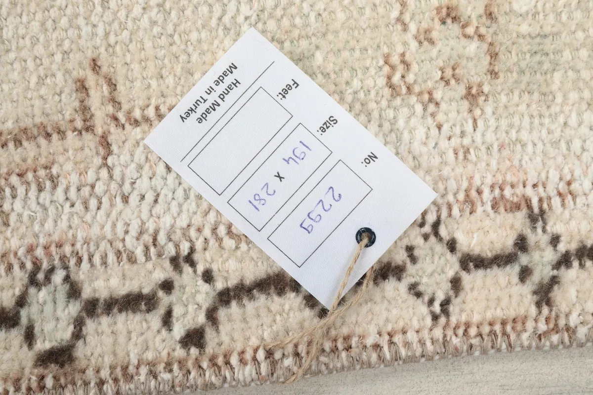 Product tag on the back of the rug displaying size and origin information