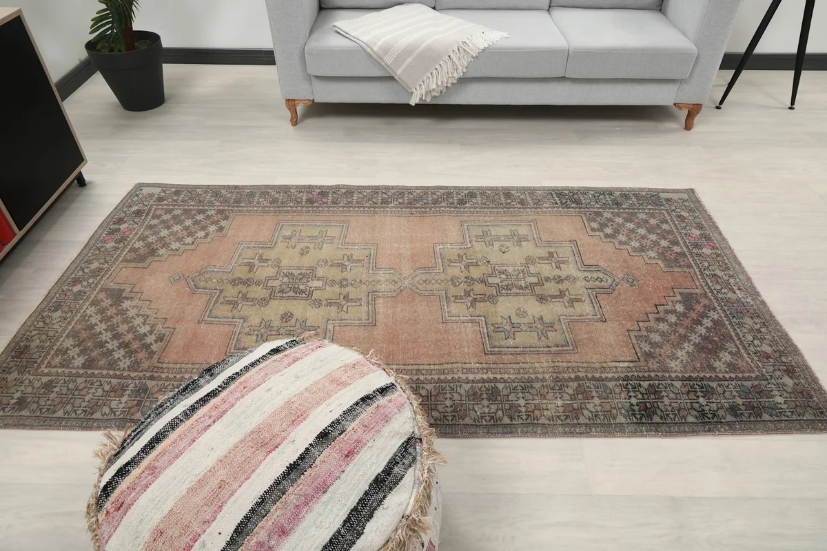 Overhead view of the rug in a room setting, capturing its full design and colors
