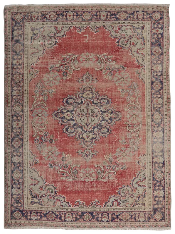 Full overhead view of the 7'6" x 10'6" vintage red Anatolian rug with central medallion and floral patterns