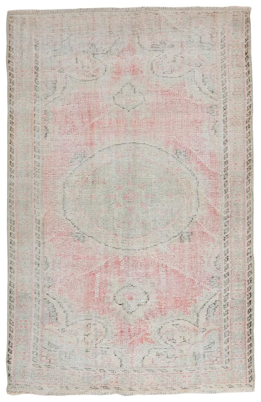 Full top view of the 5'3" x 8'5" vintage rose and gray medallion rug on a white background