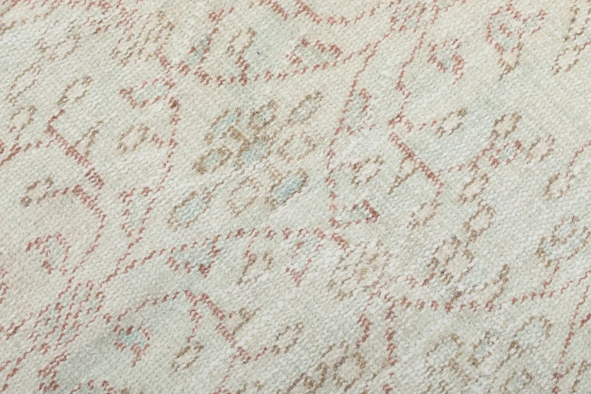 Very close-up of the low wool pile, showing texture and subtle color variations in the pattern