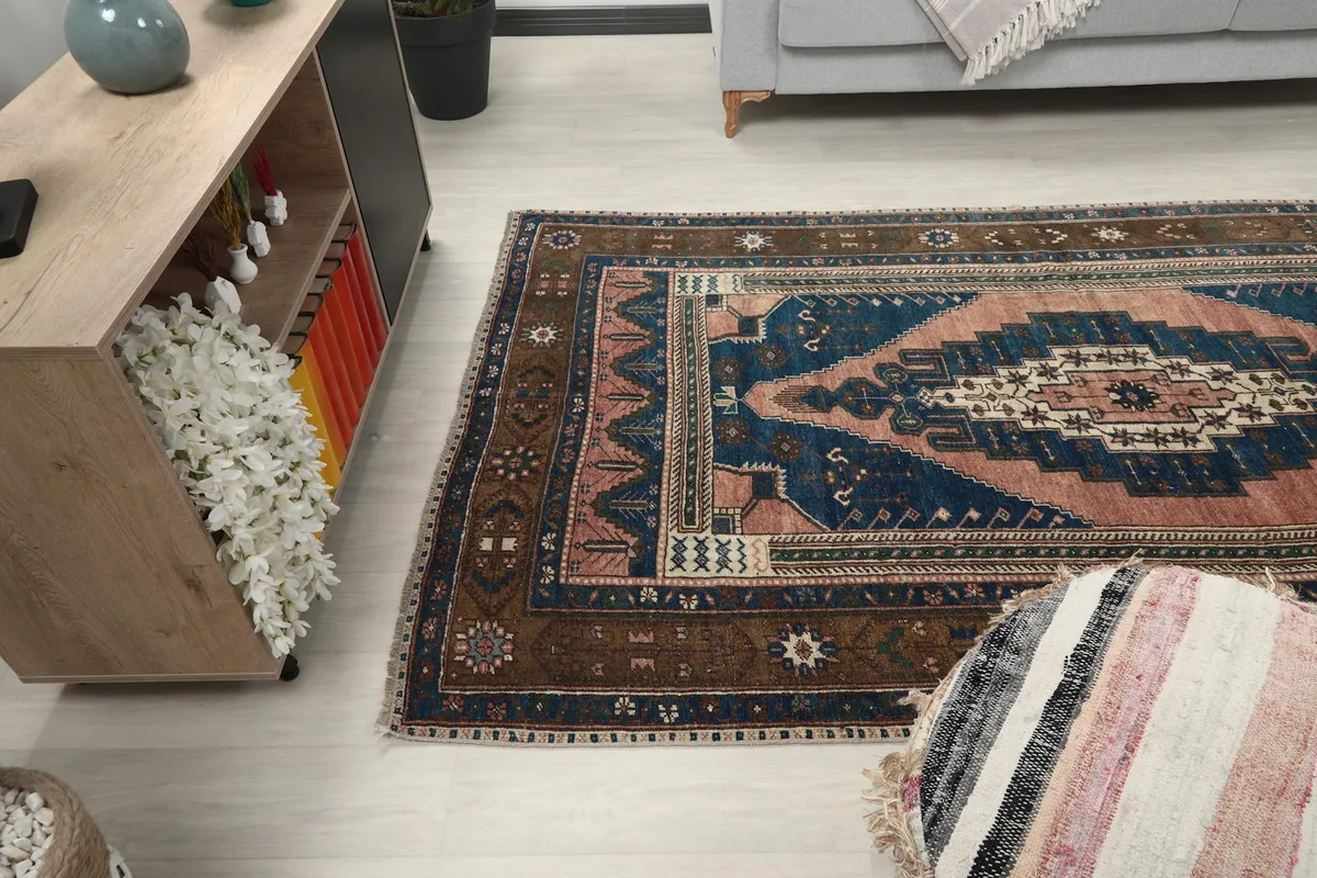 Wide shot of the rug in a living space, showing its medium size relative to furniture.