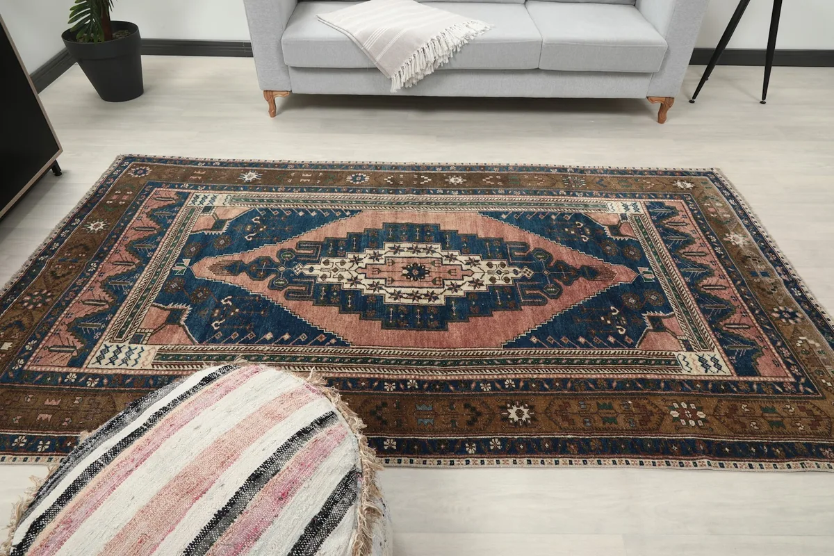 Another wide room view of the rug, emphasizing its overall presence and color palette.