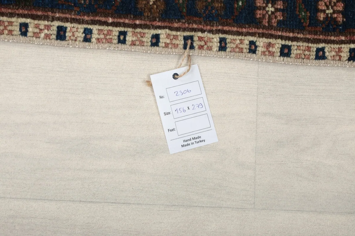 Label attached to the rug, displaying its size 5'1" x 9'2" and origin from Turkey.