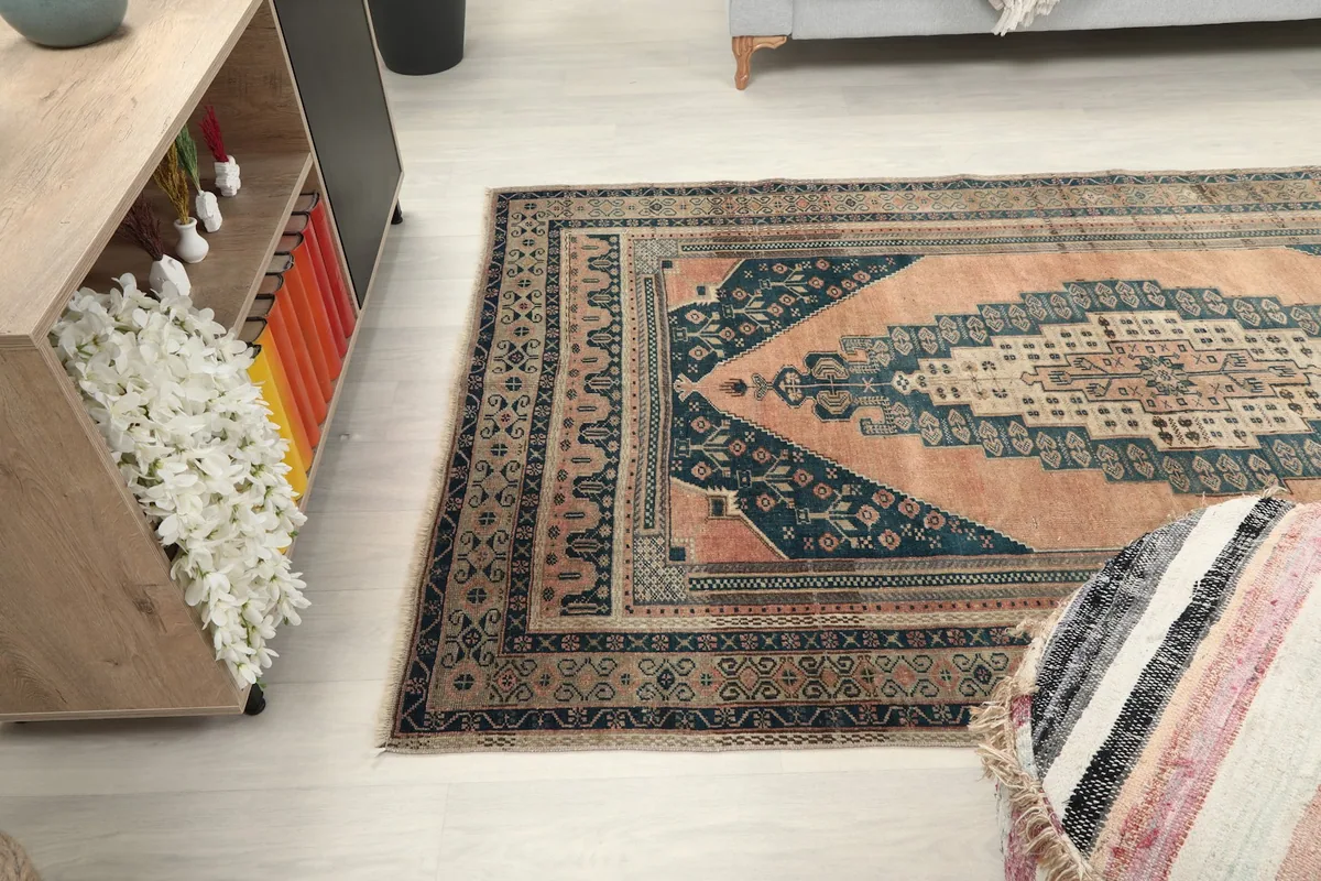 Angled view of the rug in a living space, showing its size relative to furniture