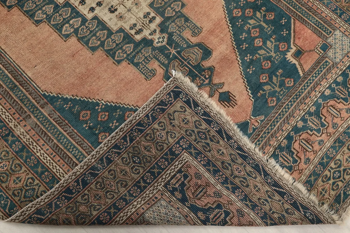 View of a folded corner, revealing the rug's thickness and the back of the weave