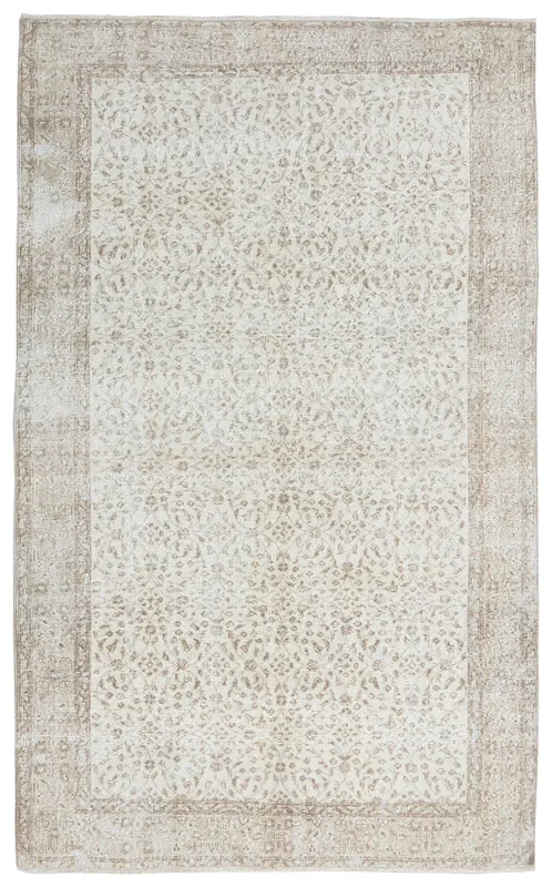 Full overhead view of the 4'11" x 8'1" ivory and tan vintage Anatolian rug
