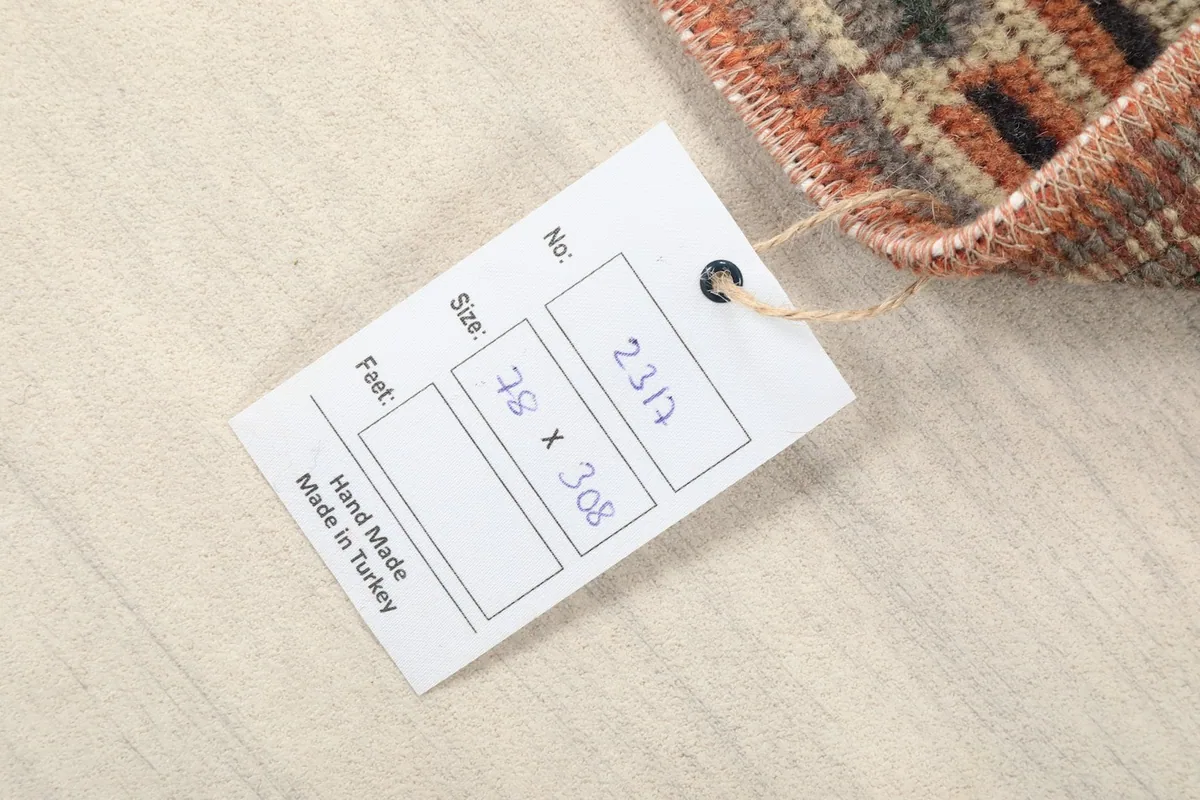 Product tag for the hand-knotted Anatolian rug, displaying its size 78 x 308 cm.