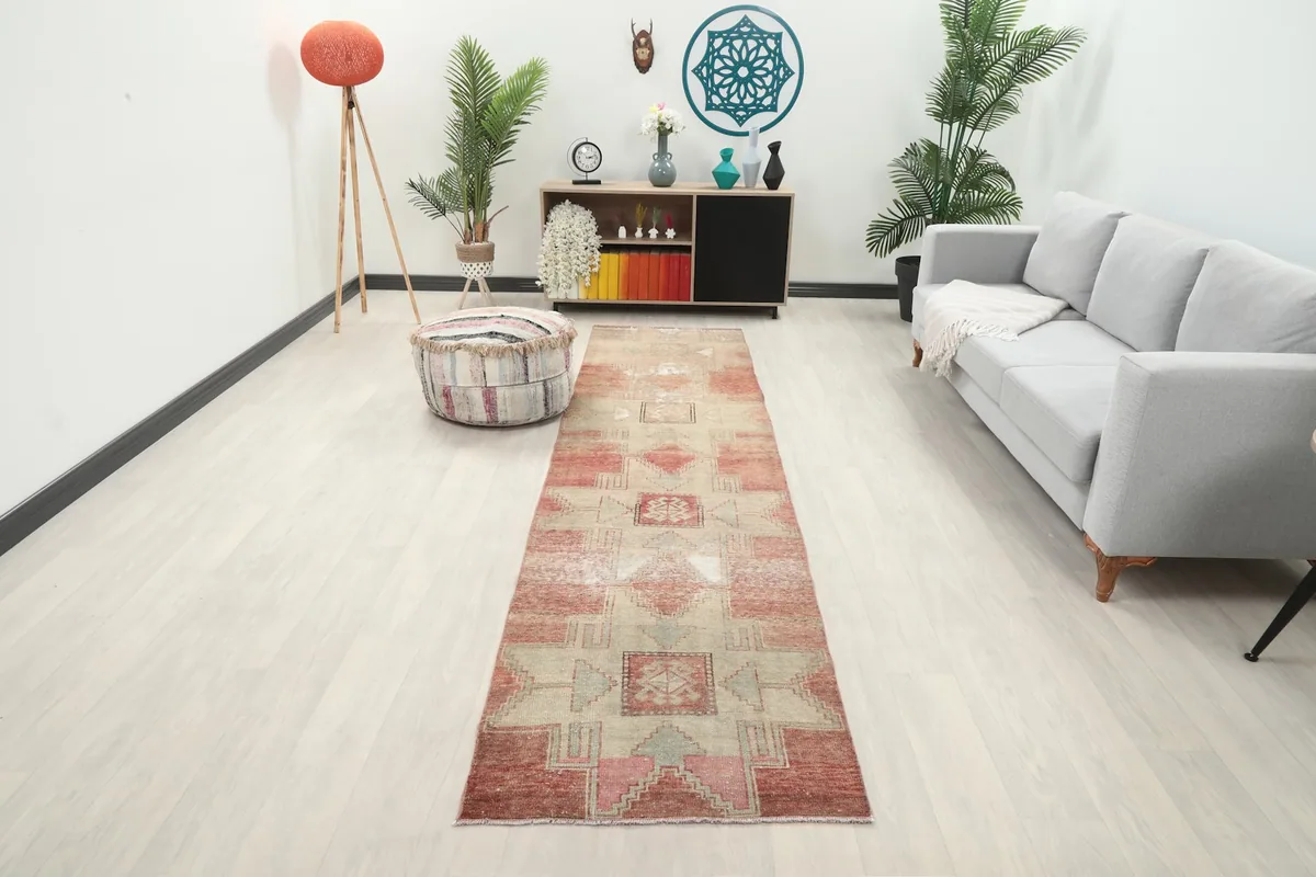 Vintage Anatolian runner rug laid out in a modern living space with light flooring and furniture