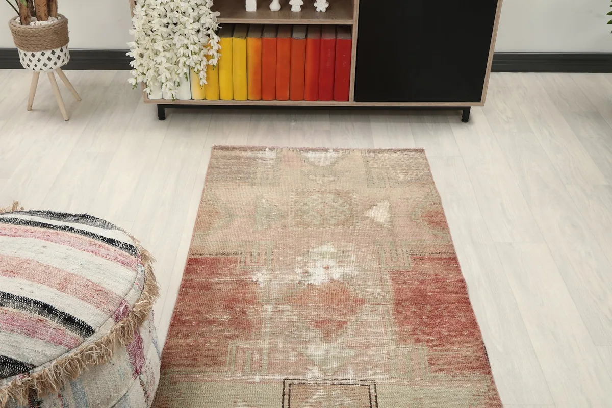 Overhead view of a section of the runner rug in a room setting, highlighting its colors