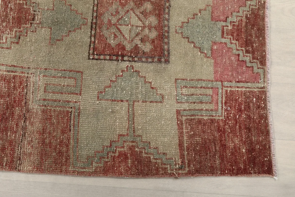 Close-up detail of the geometric patterns and color variations on the vintage runner