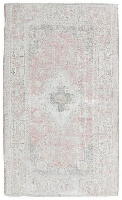Full overhead view of the rose and gray vintage Anatolian area rug on a white background.