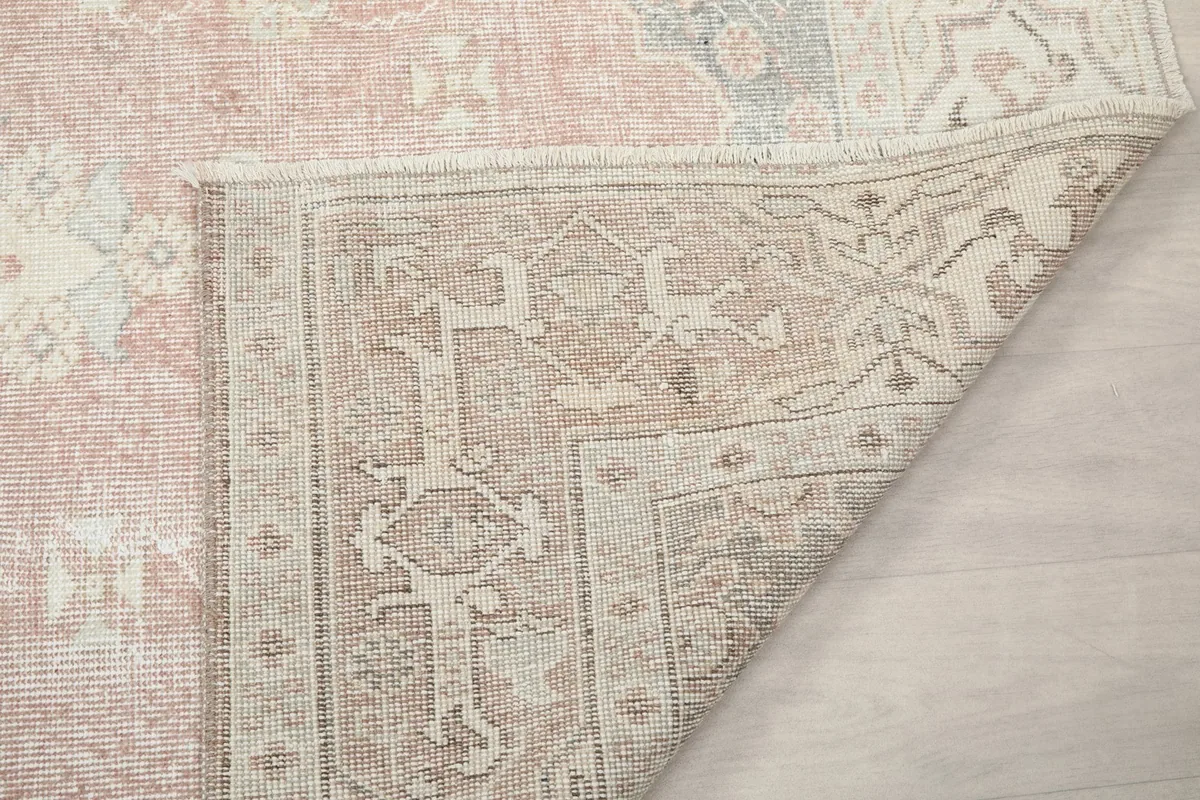 Close-up of the rug's reverse side, illustrating the intricate knotting and craftsmanship.