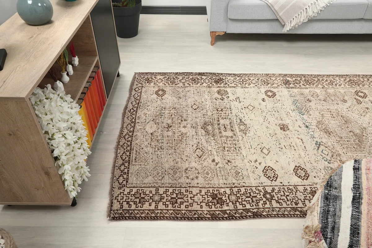 Wide shot of the rug in a living space, demonstrating its scale and how it defines the area.
