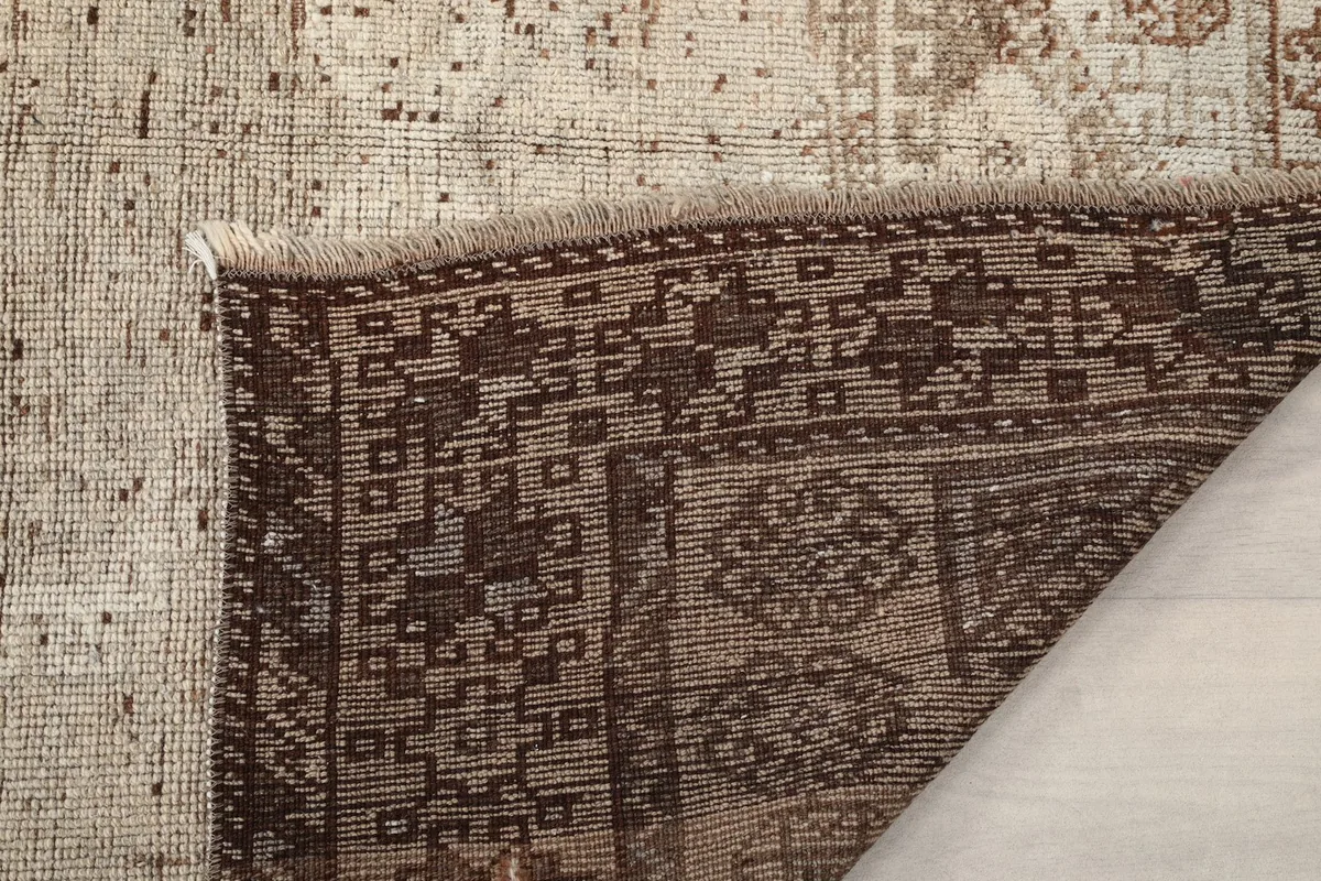 Close-up of the rug's reverse side, showing the dense knotting and craftsmanship.