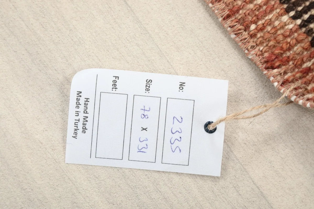Close-up of the product tag showing the dimensions 78 x 331 cm and 'Hand Made in Turkey'.