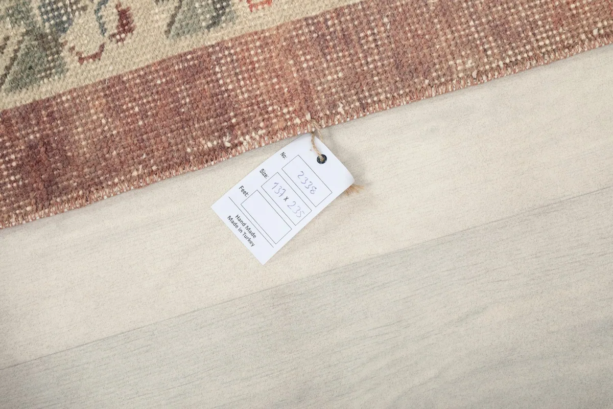Product tag on the rug, showing details like size and material.