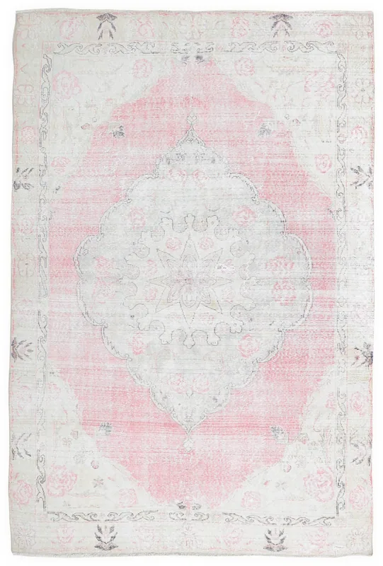 Full top view of the pink and ivory vintage Anatolian area rug on a white background.