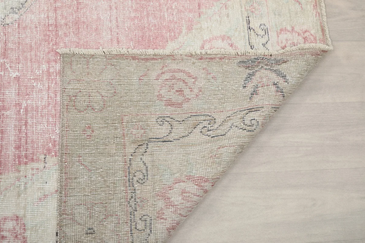 Another view of the rug's underside, showing the hand-knotted construction.