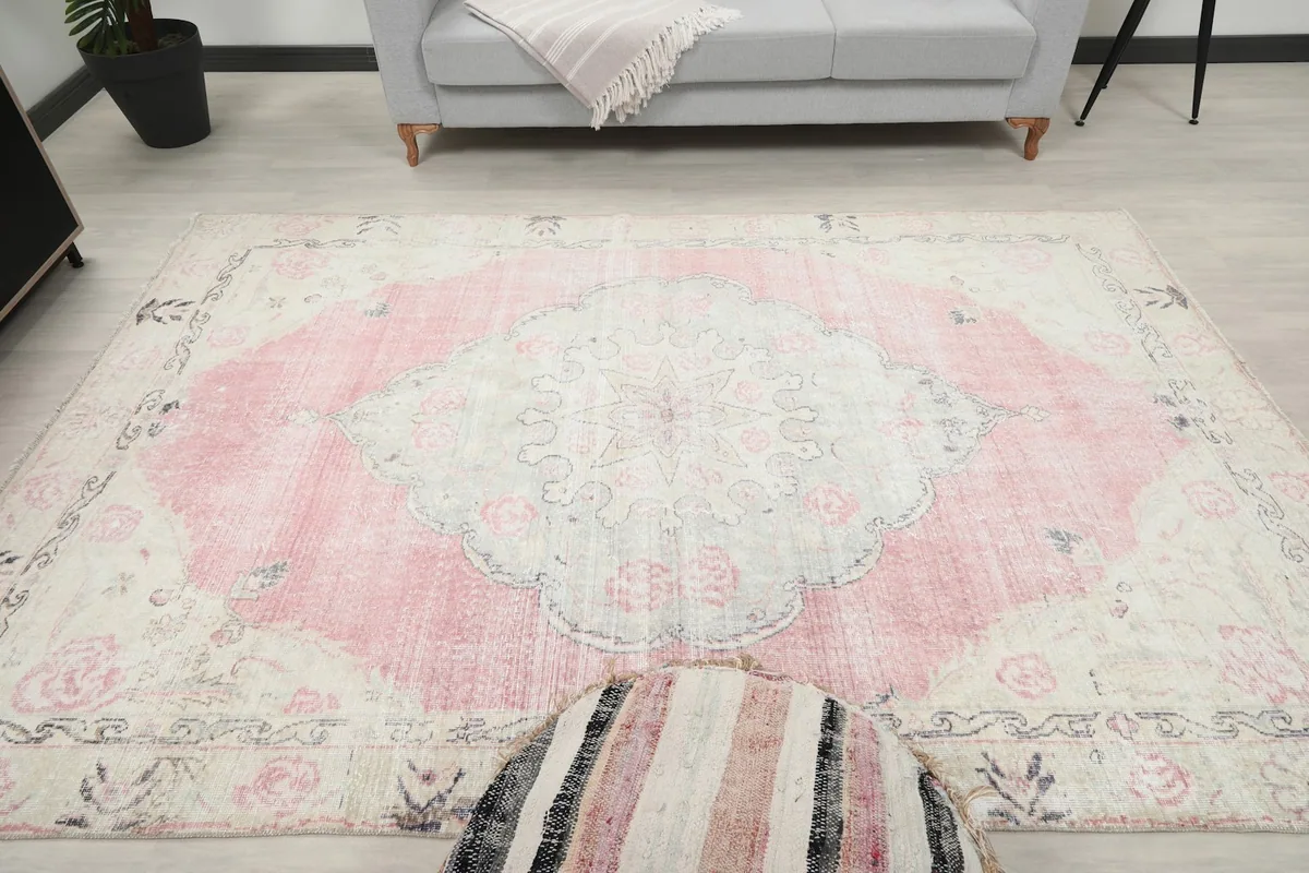 Direct overhead shot of the rug in a room, displaying the full medallion and border.