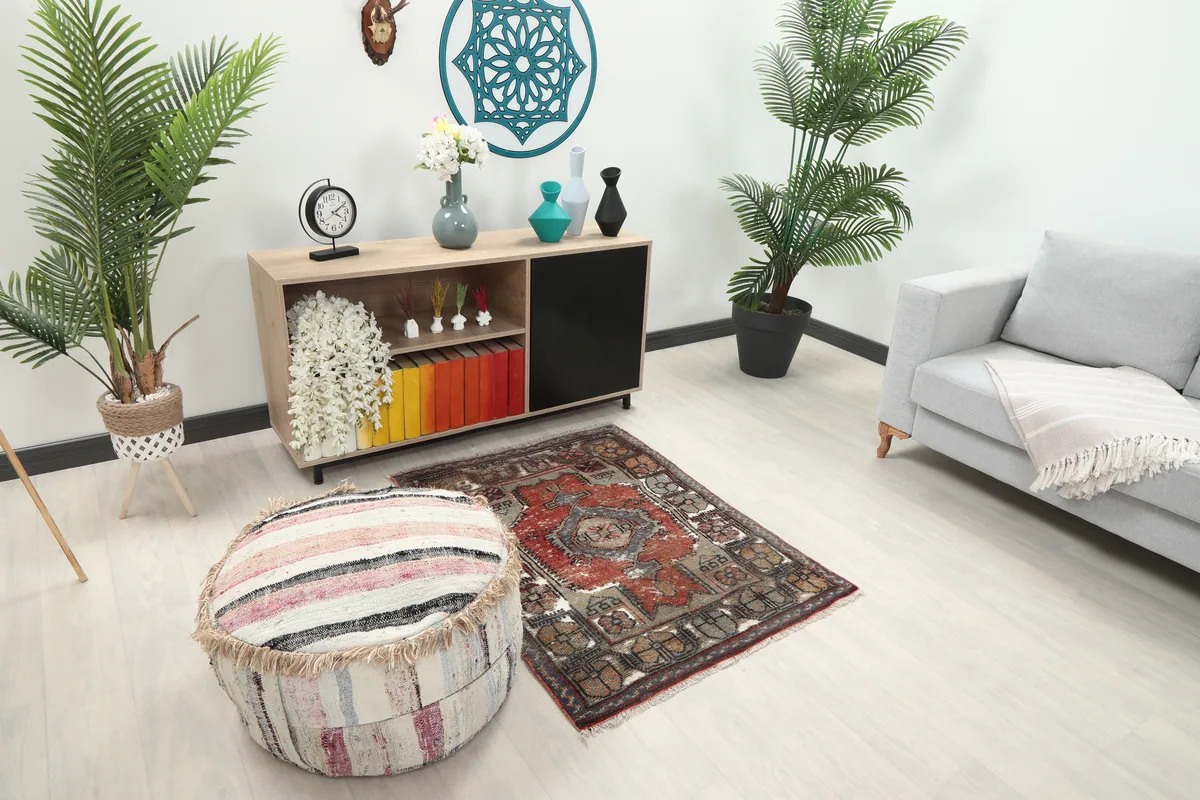Faded Red Tribal Geometric Rug from a slightly different angle within a modern room.