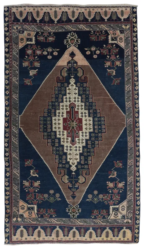 Full overhead view of the navy and brown geometric vintage Anatolian rug
