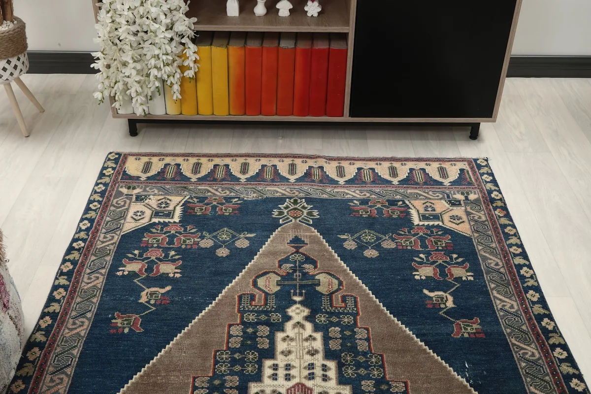 Overhead view of the rug in a room, focusing on its full pattern and colors