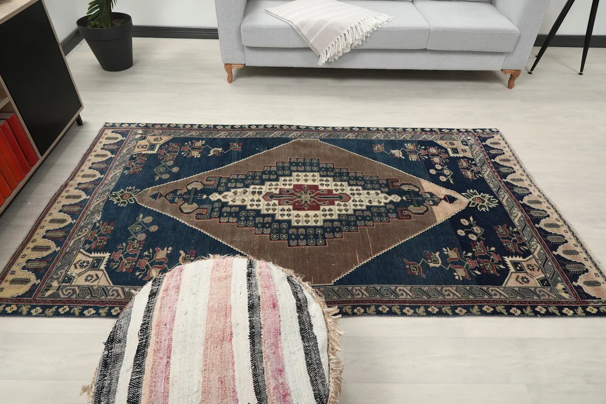 Full room view of the rug from above, with furniture providing scale