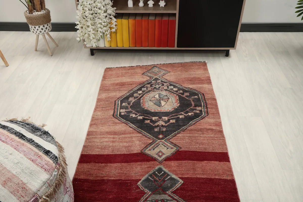 Angled view from above the runner, focusing on the upper section and its geometric patterns in a room setting.