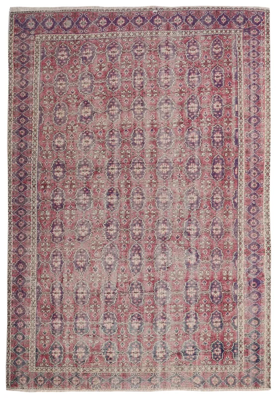 Full overhead view of the vintage Anatolian rug with rose and purple patterns
