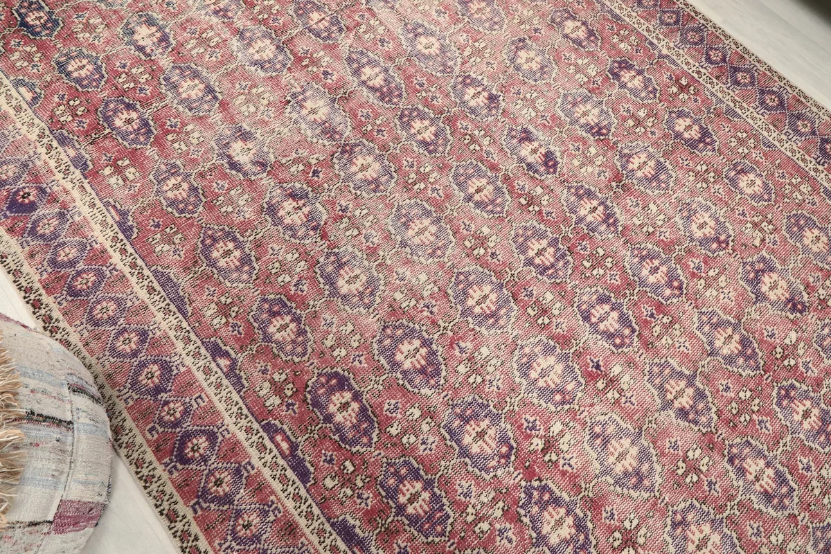 Overhead angle highlighting the repeating medallion motifs across the rug