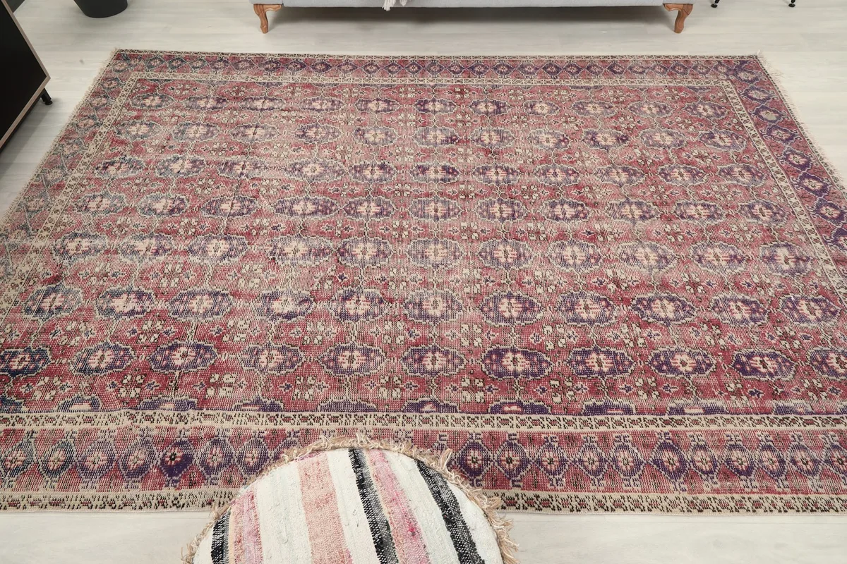Another wide room view, focusing on the rug's central placement and design