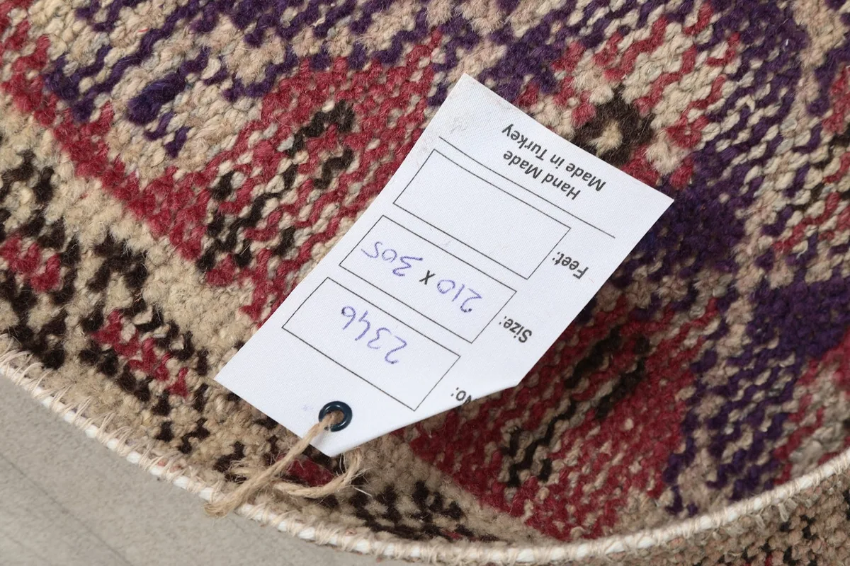 Care tag attached to the rug, displaying size and origin information