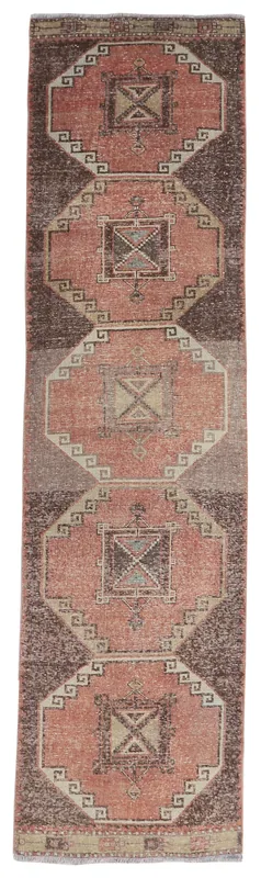 Full overhead view of the rust and brown geometric vintage runner rug