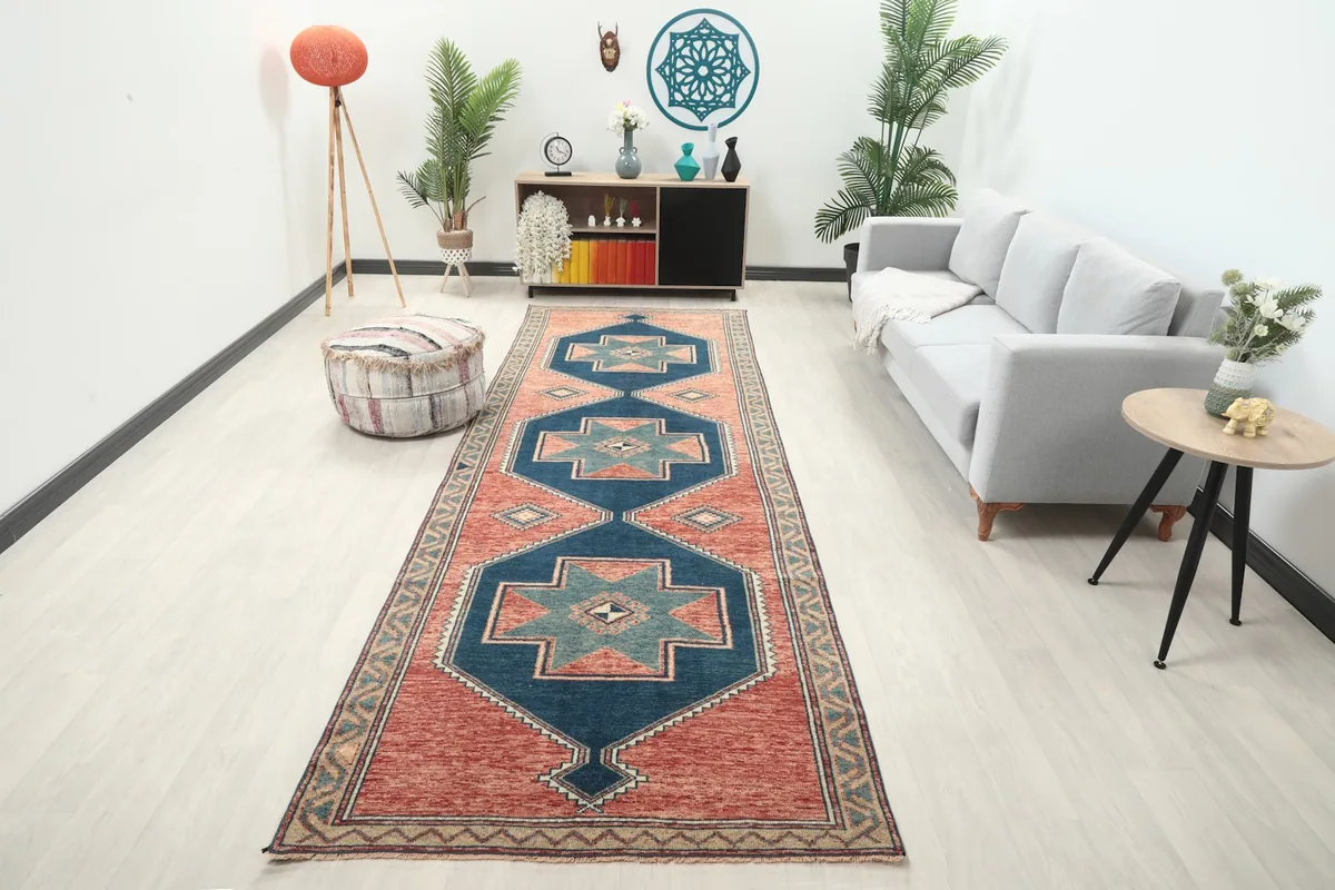 Runner rug displayed in a modern living space, showing its length and colors alongside a sofa