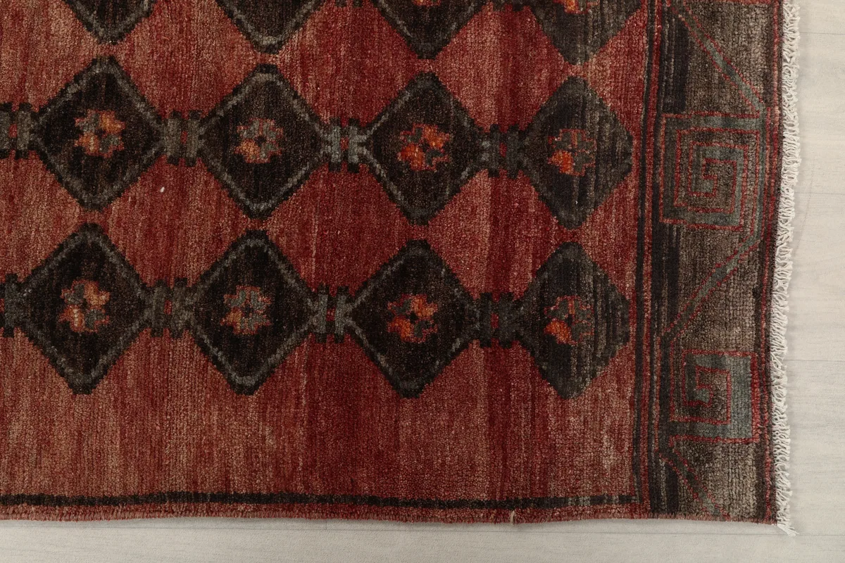Close-up of the Rust Geometric Tribal Runner's pattern and border detail
