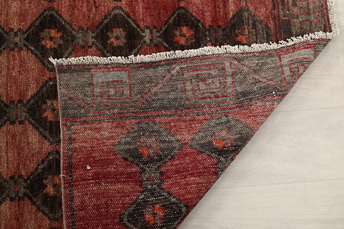 Another folded view of the runner, revealing the cotton foundation and wool pile